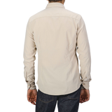 A person wearing a Stenströms Light Beige Cotton Corduroy Slimline Shirt and dark jeans, seen from the back.