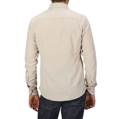 A person wearing a Stenströms Light Beige Cotton Corduroy Slimline Shirt and dark jeans, seen from the back.