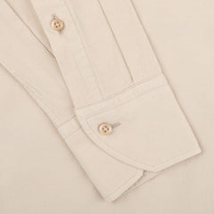 Close-up of a Stenströms Light Beige Cotton Corduroy Slimline Shirt cuff and sleeve, featuring two brown buttons and visible stitching details, showcasing the pure cotton fabric.