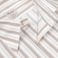 A close-up of the Light Beige Striped Cotton Fitted Body Shirt by Stenströms, featuring buttons, a pocket, and a label with brand and fabric care instructions. Made from pure cotton twill, it offers modern comfort with its Fitted Body cut.