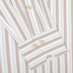 A close-up of the Light Beige Striped Cotton Fitted Body Shirt by Stenströms, highlighting its beige and white vertical stripes. This retro-inspired shirt is made from pure cotton twill and features a fitted body cut with buttoned cuffs and sleek buttons along the placket.