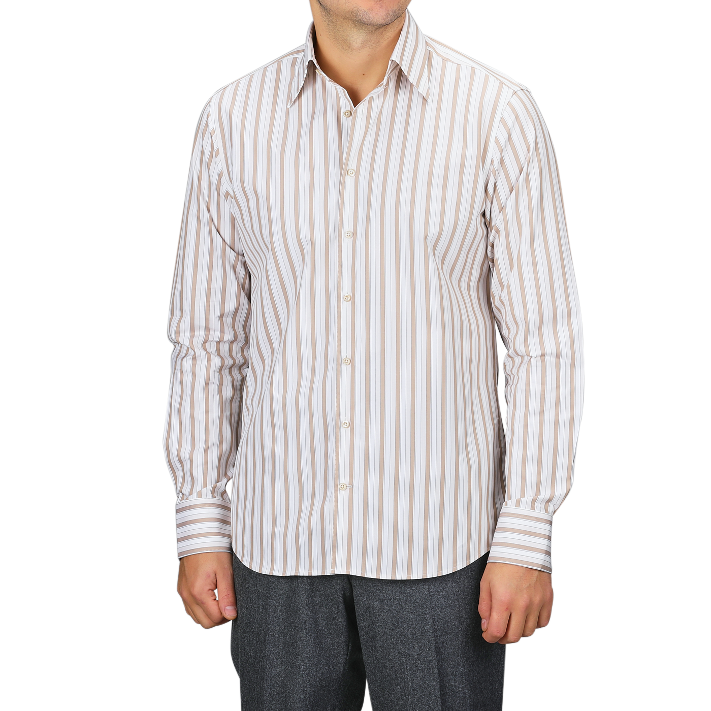 A man wearing a Stenströms Light Beige Striped Cotton Fitted Body Shirt pairs it with gray pants, confidently standing against a plain backdrop. His timeless style is highlighted by the pure cotton twill fabric.