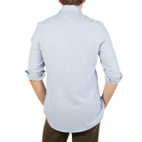 The back view of a man wearing a blue Stenströms Light Blue Brushed Cotton Fitted Body Shirt.