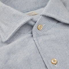 A close up of a Stenströms Light Blue Brushed Cotton Slimline Shirt with gold buttons.