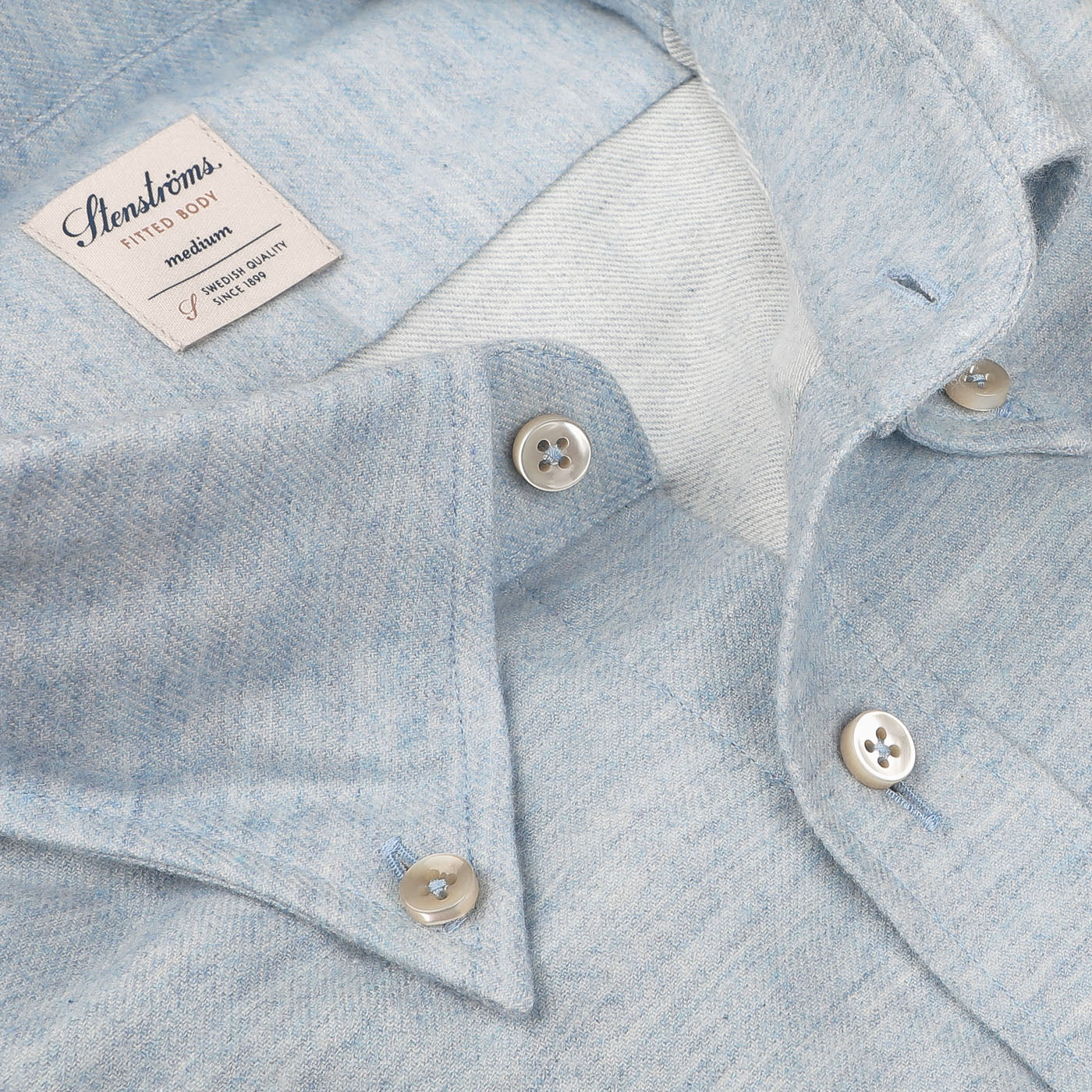 Close-up of the Light Blue Cotton Flannel Fitted Body BD Shirt by Stenströms, featuring white buttons, a pointed collar, and a visible brand label on the inside. The brushed cotton twill gives it an incredibly soft feel.