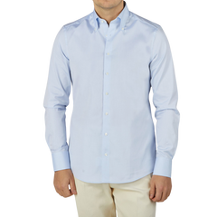 A man wearing a Stenströms Light Blue Cotton Oxford BD Slimline Shirt and tan pants.