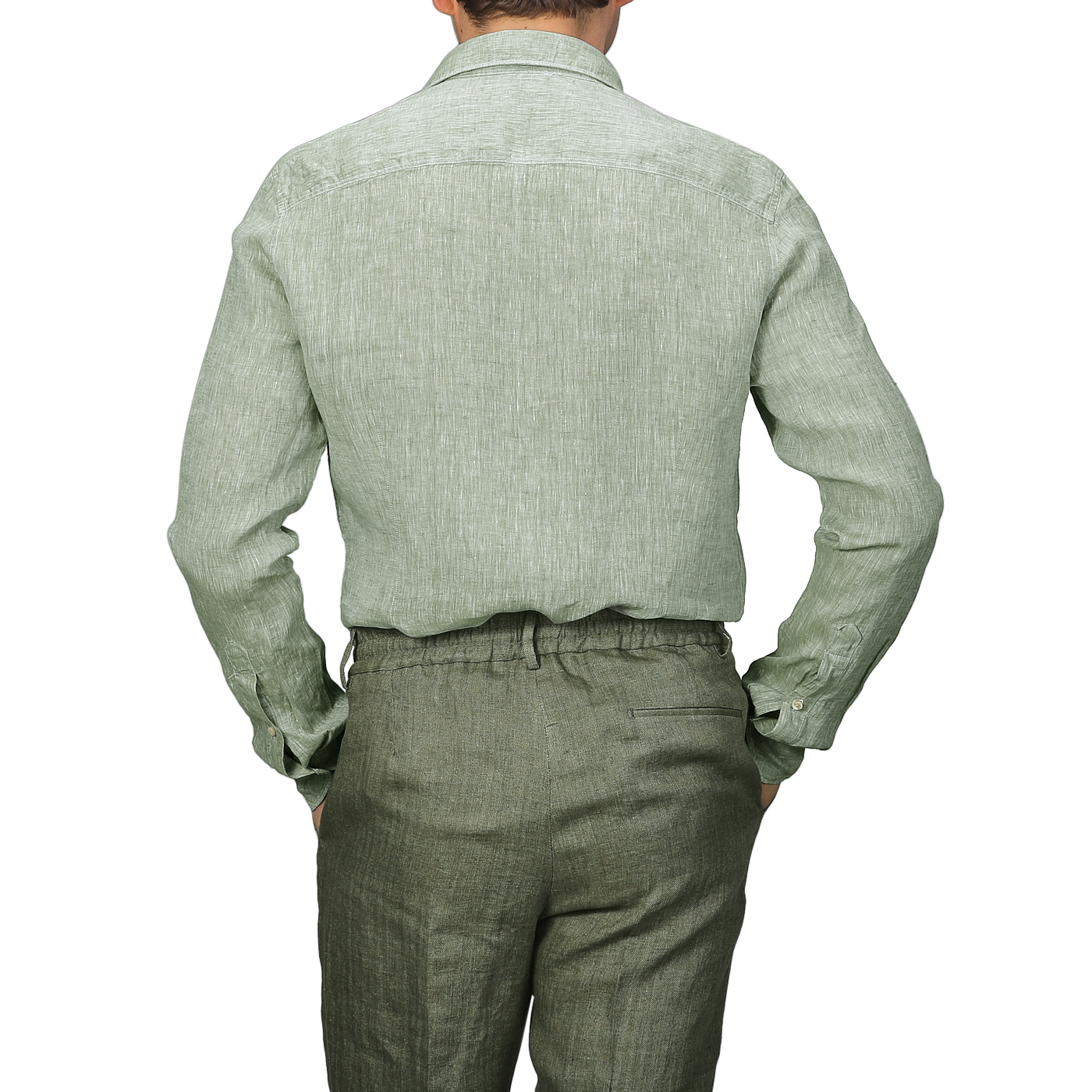 A person is shown from the back wearing a Stenströms Light Green Linen Cutaway Slimline Shirt and matching pants, a summer essential that combines effortless style and comfort.