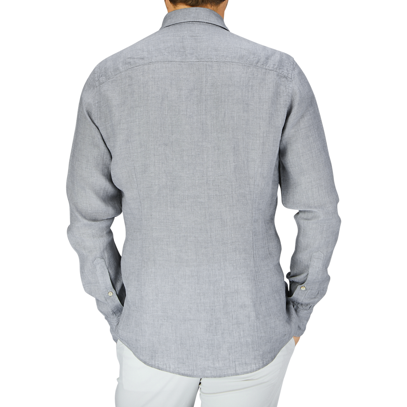 Rear view of a person wearing a Stenströms Light Grey Linen Fitted Body Shirt with cutaway collar and white pants.