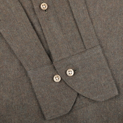 Close-up of a moss green cotton flannel shirt with buttoned cuffs, showcasing a cut-away slimline design for a tailored fit by Stenströms.