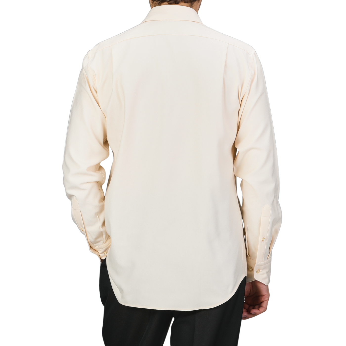 Rear view of a person wearing the Off-White Cotton Flannel Fitted Body Shirt by Stenströms with mother-of-pearl buttons, paired with dark pants against a neutral background.