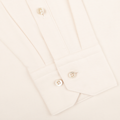 Close-up of the cuff from Stenströms' Off-White Cotton Flannel Fitted Body Shirt, featuring two fastened mother-of-pearl buttons and one visible sleeve button.