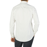 The back view of a man wearing an Off-White Cotton Twill Fitted Body Shirt by Stenströms.