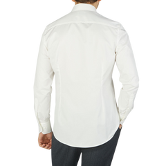 The back view of a man wearing an Off-White Cotton Twill Fitted Body Shirt by Stenströms.