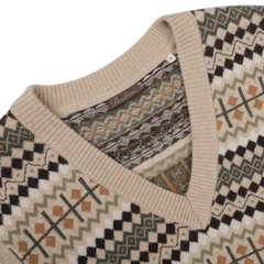 Close-up of the Stenströms Taupe Beige Merino Wool Patterned Slipover, showcasing its V-neck design crafted from soft merino wool, with a geometric pattern in beige, black, green, and brown tones. Part of our exclusive capsule collection.