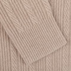 Close-up of the Taupe Beige Structured Merino Rollneck by Stenströms, highlighting its ribbed and cable patterns that showcase the luxurious texture of merino wool.