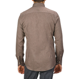 A person wearing a Taupe Brown Cotton Flannel Fitted Body BD Shirt by Stenströms and dark pants is shown from the back.