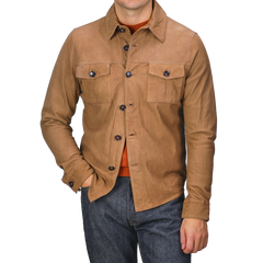 A person wearing a Stenströms Tobacco Brown Lamb Suede Overshirt, featuring a regular fit and two chest pockets, paired with blue jeans. The face is not visible.