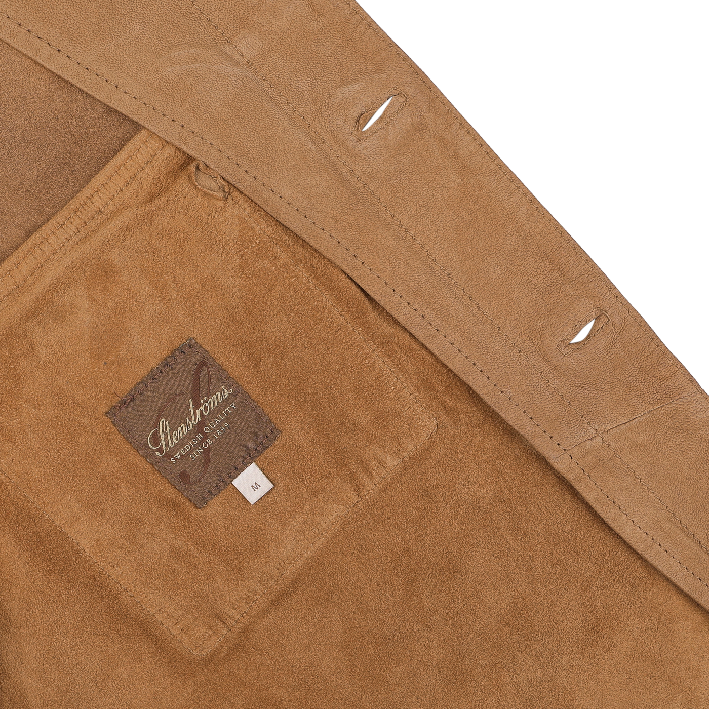 Close-up of the Stenströms Tobacco Brown Lamb Suede Overshirt, highlighting the meticulous stitching and a rich brown fabric label with "Handsome" and "Fine Tailoring Outfits M" inside.