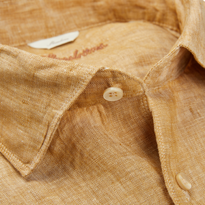 A close up of a Stenströms Tobacco Brown Linen Fitted Body Shirt, a summer essential.
