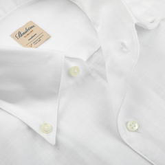 A close-up of the White Soft Cotton BD Slimline Shirt by Stenströms highlights its timeless button-down collar and classic design, hinting at its quality craftsmanship—perfect for those who appreciate an elegant yet effortless seasonal shirt.