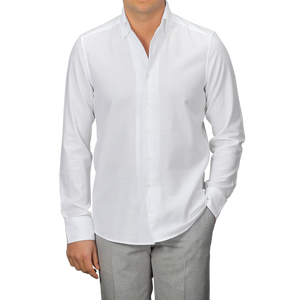 Someone wearing a White Soft Cotton BD Slimline Shirt by Stenströms and gray pants stands against a plain background.