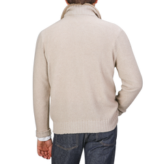 A person clad in a Light Beige Cashmere Fur Collar Cardigan and jeans is viewed from the back against a plain background, showcasing the subtle elegance of Stile Latino.