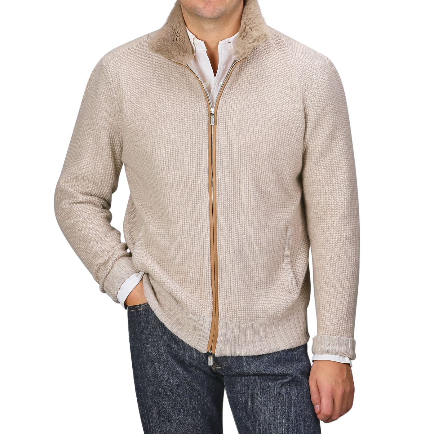 A person wearing the Light Beige Cashmere Fur Collar Cardigan from Stile Latino over a white shirt and dark jeans effortlessly exudes the elegance of a luxury brand.