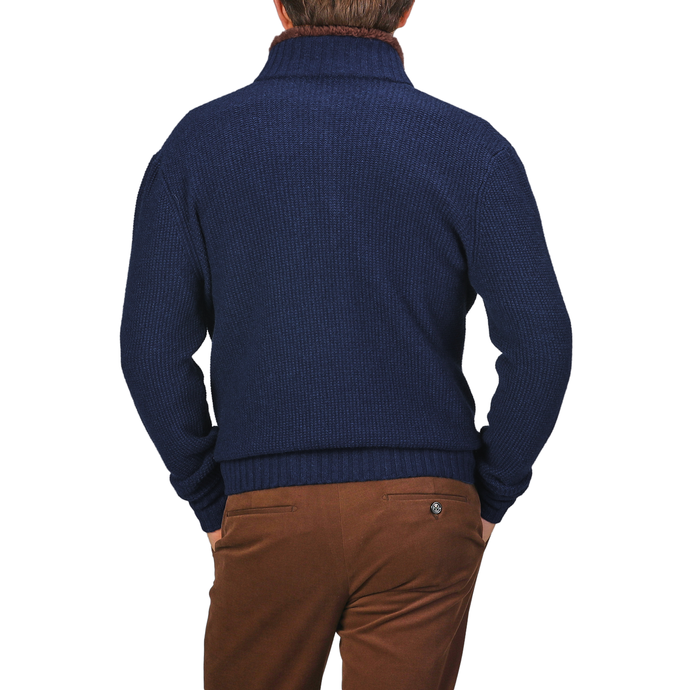 A person in a Royal Blue Cashmere Fur Collar Cardigan by Stile Latino and brown trousers, viewed from behind, stands against a neutral background.