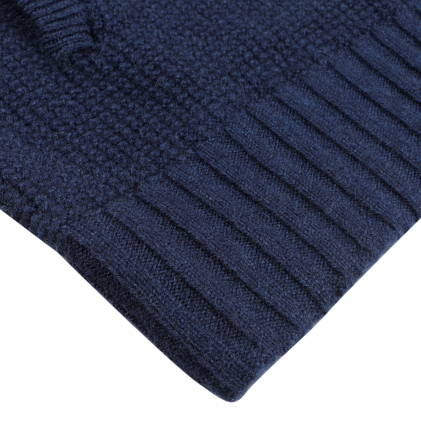 Close-up of a textured Royal Blue Cashmere Fur Collar Cardigan with ribbed cuffs from Stile Latino on a light surface.