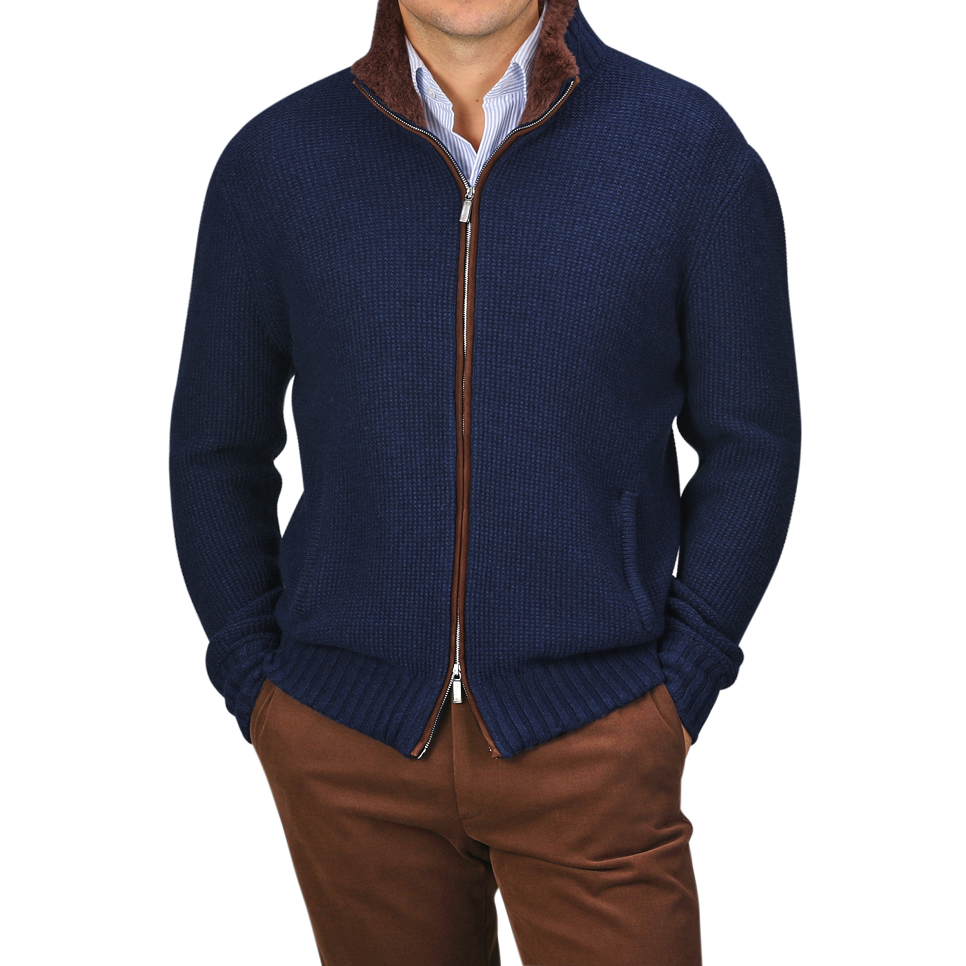 A person is dressed in a Royal Blue Cashmere Fur Collar Cardigan from Stile Latino, worn over a blue collared shirt and brown pants. This cardigan showcases cashmere fibers with a distinguished brown fur collar, radiating refined elegance.