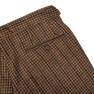 The back pocket of a Studio 73 Brown Rustic Checked Wool Tweed Pleated Trouser.