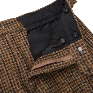 Studio 73 by Cavaliere presents a close up of the Brown Rustic Checked Wool Tweed Pleated Trousers made with pure wool.