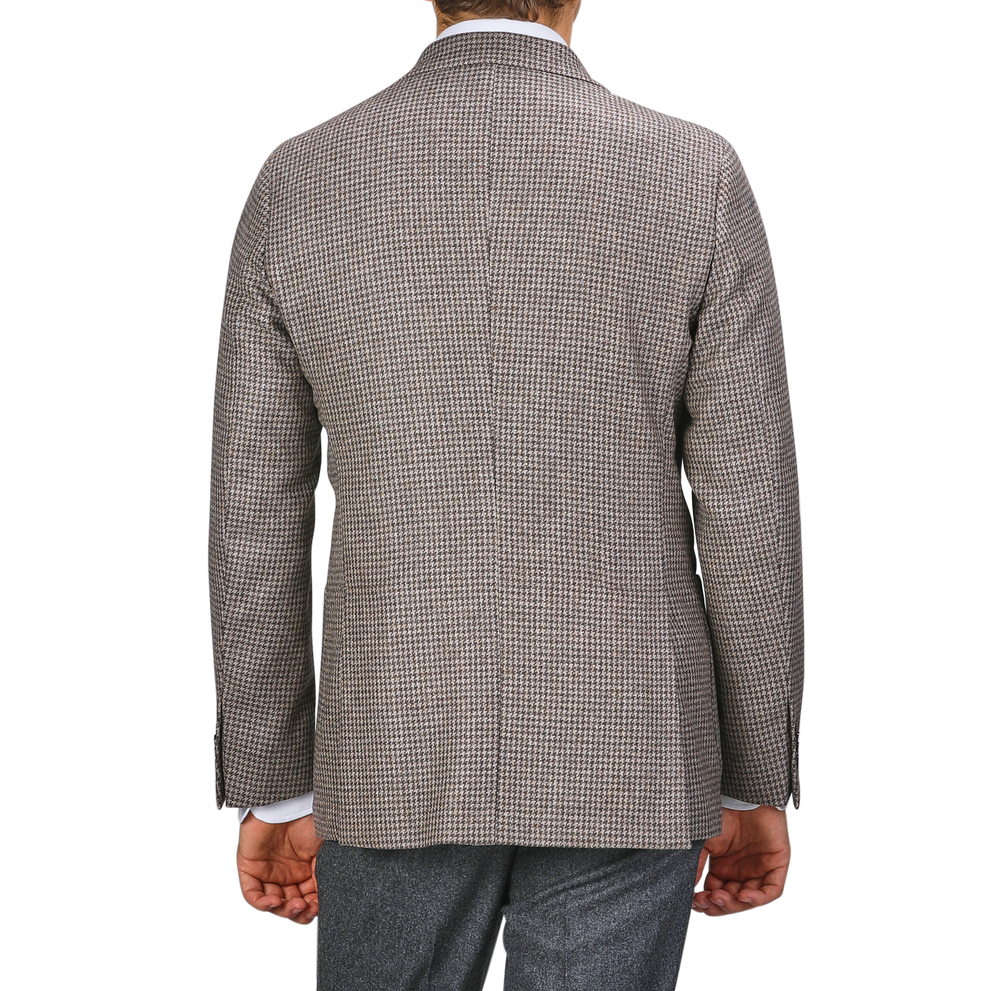 A person is pictured from behind against a plain background, wearing Studio 73's Brown Houndstooth Lambswool Blazer and dark grey pants made from super 110s lambswool.