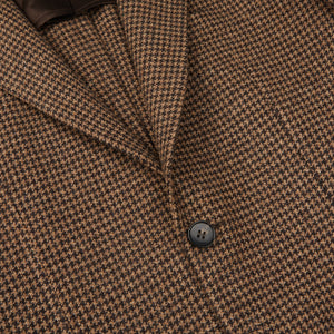 A close up of a brown and black houndstooth Studio 73 blazer.