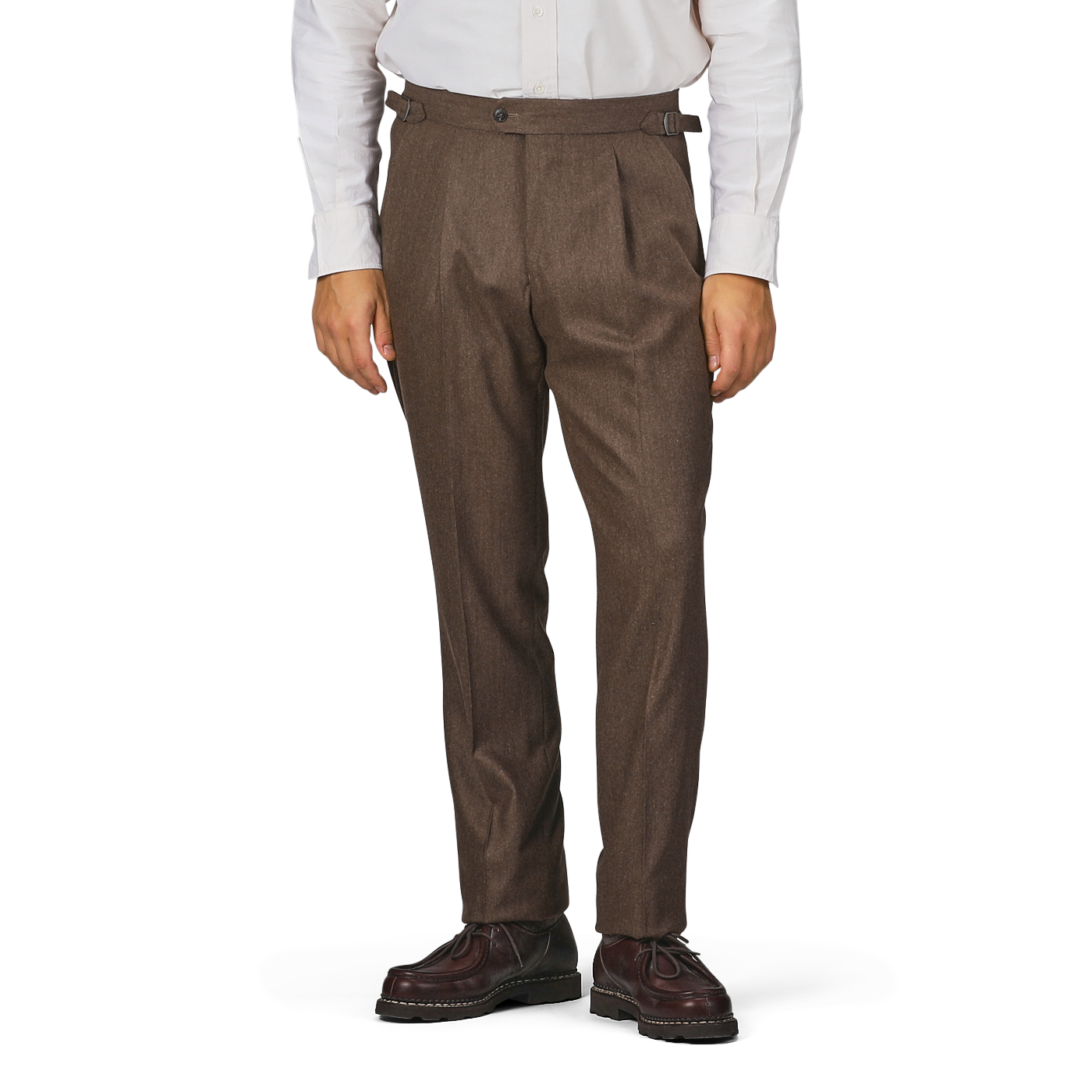 A person wearing a white long-sleeve shirt, Studio 73's Brown Melange Wool Flannel Pleated Trousers, and brown shoes stands against a plain background.