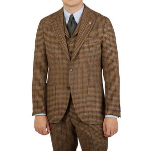 A man wearing a Studio 73 Brown Rustic Checked Wool Tweed Blazer.