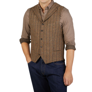 A man in a Brown Rustic Checked Wool Tweed Waistcoat made by Studio 73 is posing for a photo.
