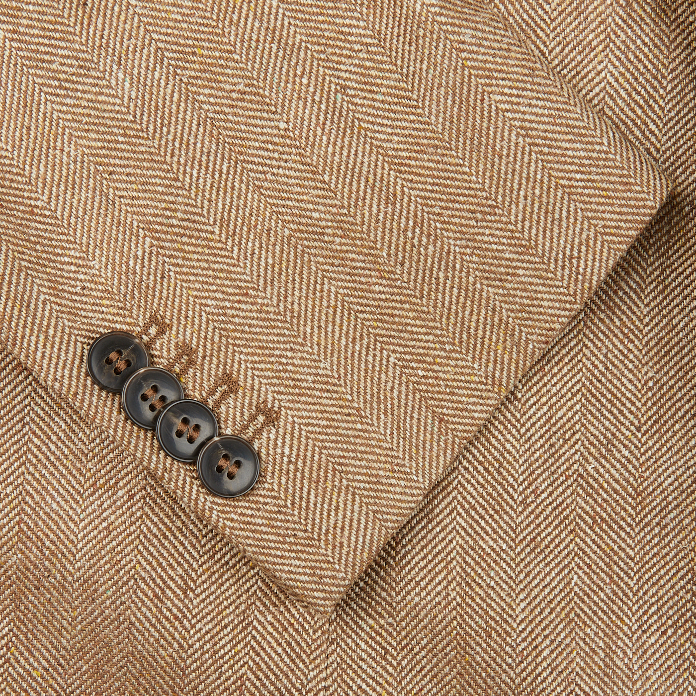 A close up of a Studio 73 Camel Brown Herringbone Pure Silk Blazer.