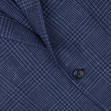 Close-up of a textured Studio 73 Dark Blue Checked Wool Linen Blazer fabric with a button, likely part of an Italian woven garment.