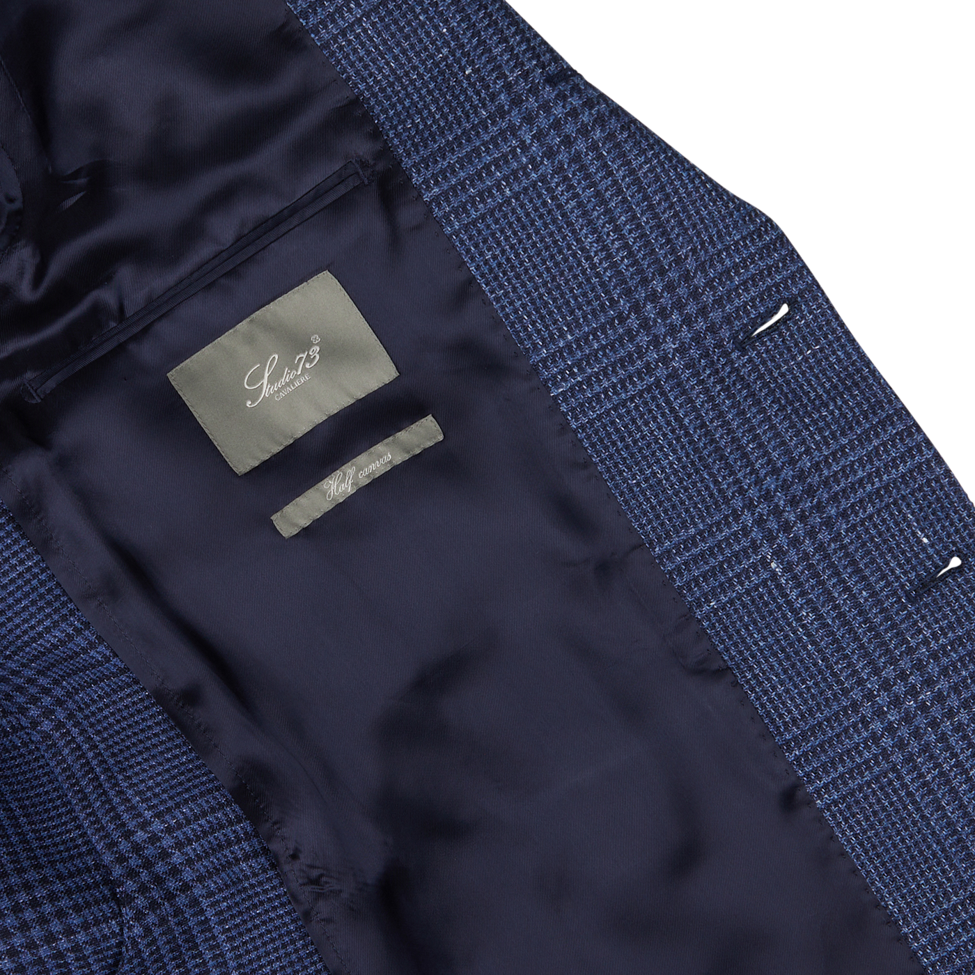 Close-up of the lining and label inside a blue Studio 73 Dark Blue Checked Wool Linen Blazer.
