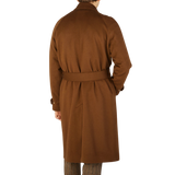 The back view of a man wearing Studio 73's Dark Brown Camel Wool Cashmere Raglan Coat.