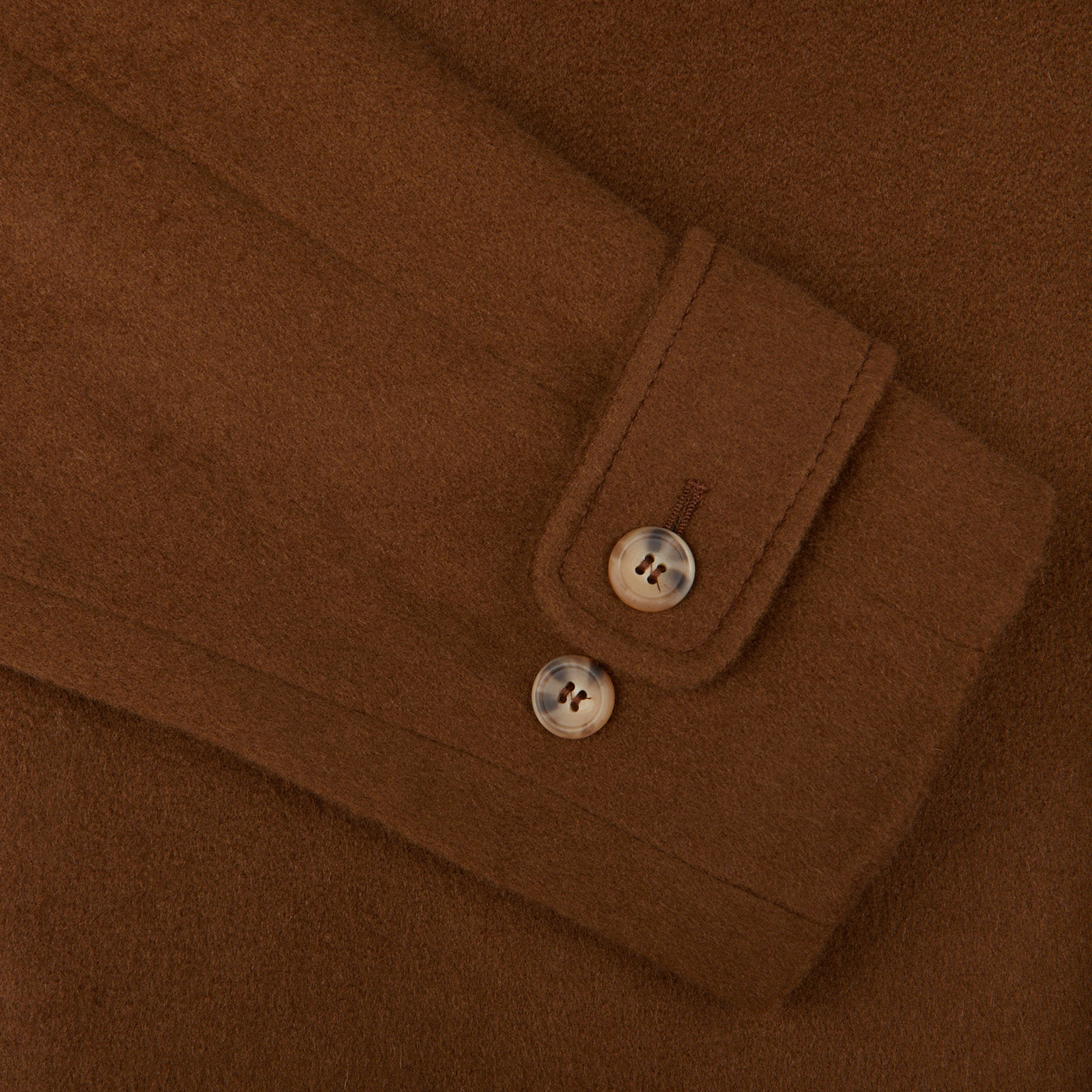 A close up of a Dark Brown Camel Wool Cashmere Raglan Coat with buttons by Studio 73.