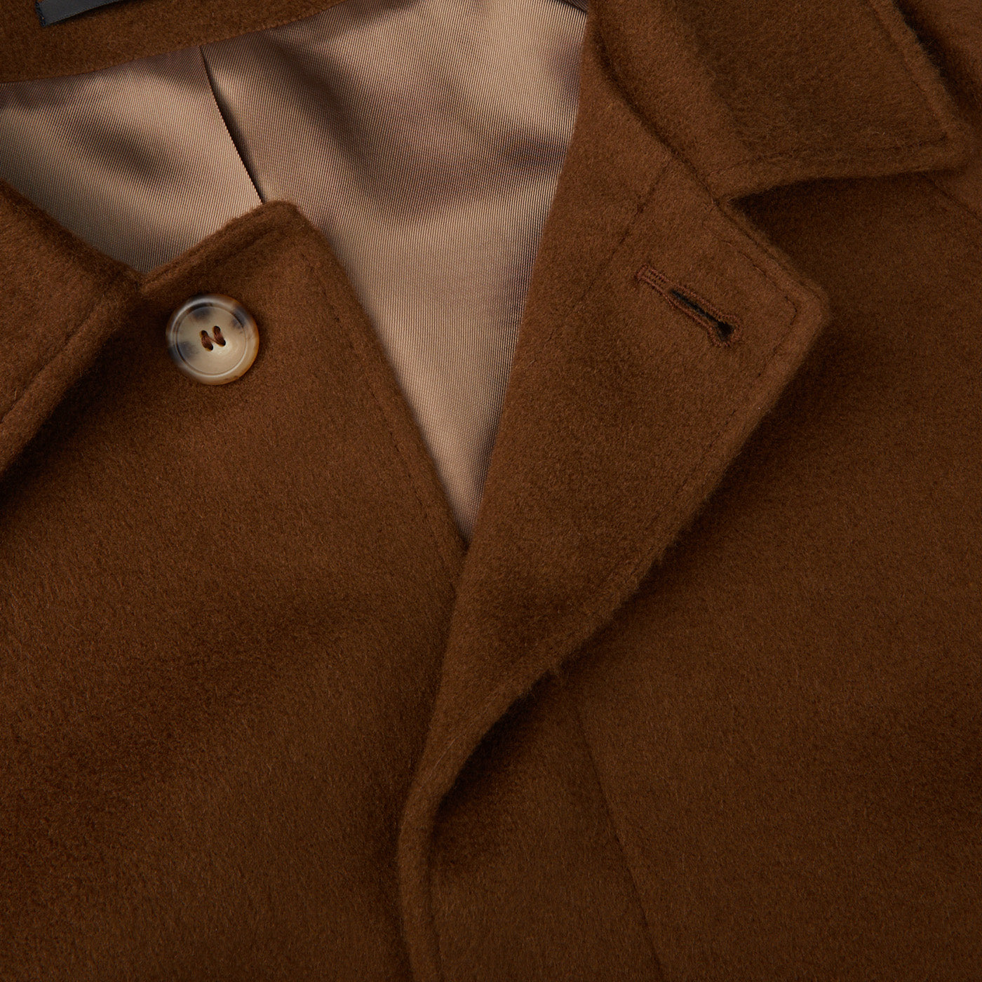 A close up image of a Dark Brown Camel Wool Cashmere Raglan Coat from Studio 73.