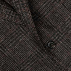 Close-up of a Studio 73 Dark Brown Checked Wool Cashmere Blazer, showcasing a classic black button detail.