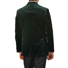 A person wearing the Studio 73 Dark Green Cotton Velvet Dinner Jacket is viewed from the back against a plain background, radiating an aura of sophisticated formal evening wear.