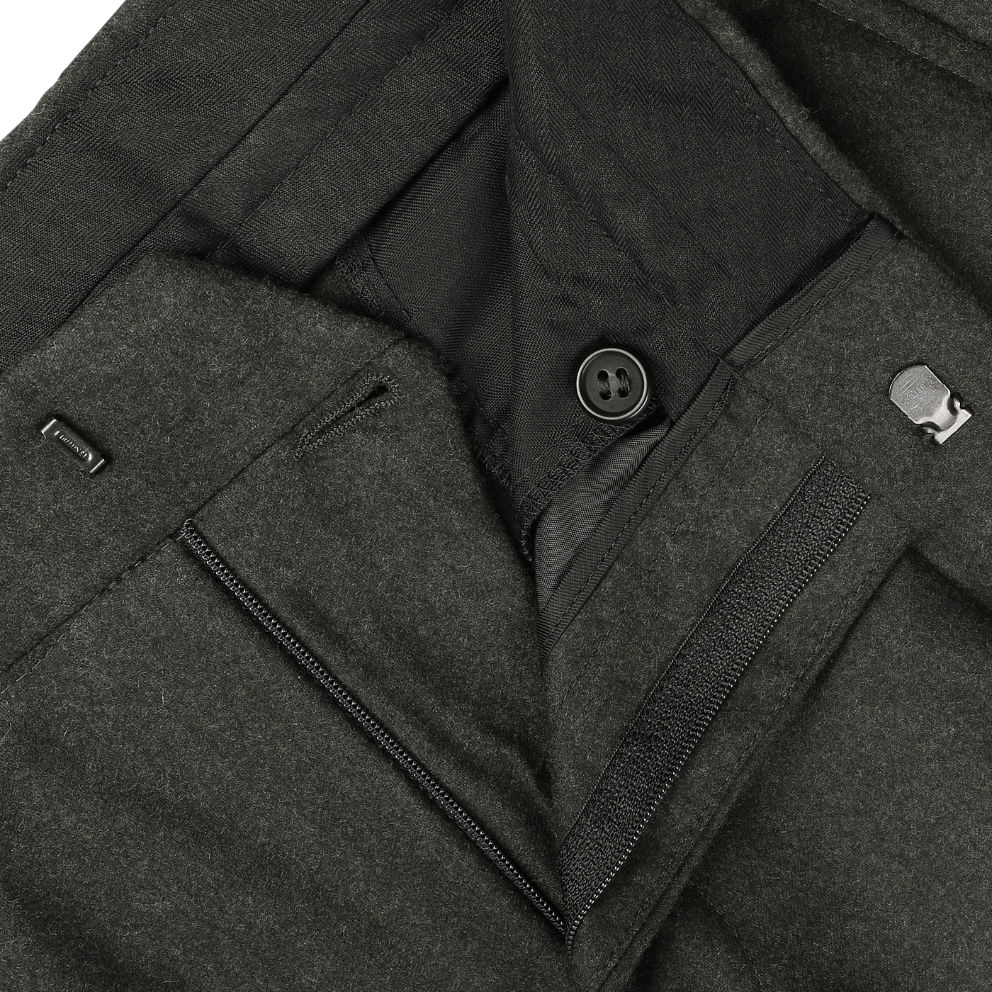 Close-up view of an open pair of Studio 73 Dark Green Wool Flannel Pleated Trousers, showcasing the button, zipper, and clasp fastening details.