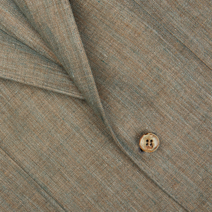 Close-up of a Studio 73 Green Melange Herringbone Linen Blazer with a single button.