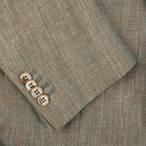 Close-up of a Studio 73 Green Melange Herringbone Linen Blazer with four buttons.