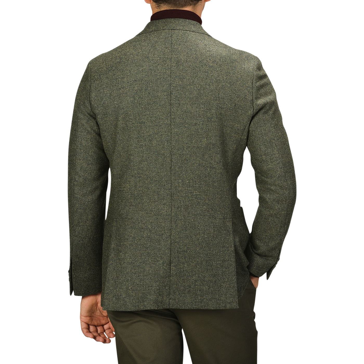 A man wearing a Studio 73 Green Melange Wool Tweed Blazer stands with his back to the camera, his left hand in his pocket.