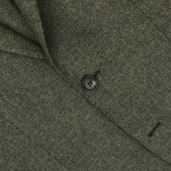 Close-up of the Studio 73 Green Melange Wool Tweed Blazer, highlighting a black button and buttonhole.